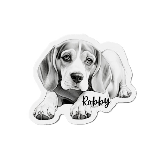 "This adorable dog magnet features a playful Beagle puppy with big, soulful eyes and a tri-color coat, sitting happily on a lush green lawn."
